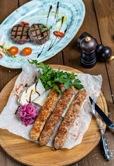 veal, chicken and lamb kebab