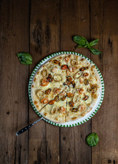 seafood pizza cooked in a wood-fired oven