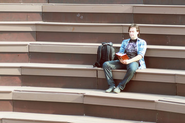 Fototapeta na wymiar man outdoor alone sit on step