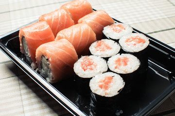 Delicious set of rolls of rice and fish.