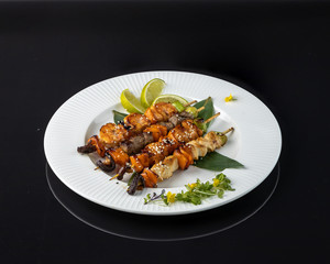 Kebabs with Teriyaki sauce Salmon, shrimp, beef, chicken, Shiitake mushrooms, sweet pepper, leek