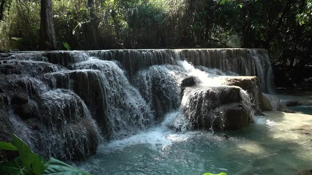 Slowmotion Dolly In of Beautiful Kuang Si Waterfall with Heavy Water