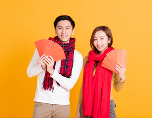 happy asian young couple celebrating  chinese new year