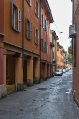 Narrow street in Bologna, Italy.