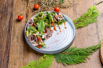 roast beef salad with baked vegetables and feta cheese