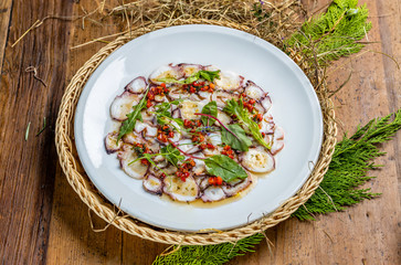 grilled octopus carpaccio with herbs