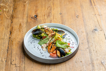 seafood avacado salad: mussels, shrimp, squid, baby octopus