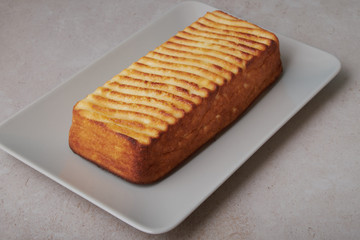 A portion of cottage cheese casserole with strawberry jam and peaches