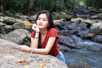 portrait tourist girl in beautiful water fall