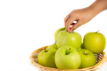 Apples in a fruit basket are good for a healthy diet in a white background.
