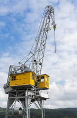 Vertical view of a port crane in the old industrial area of ​​the town of San Esteban de Pravia...