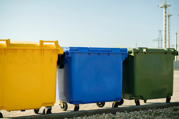 sorting the garbage waste, three color trash urns in the city, recycling