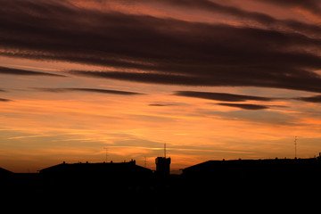 sunset in the city,silhouette,evening,clouds,skyline,panorama,orange,
