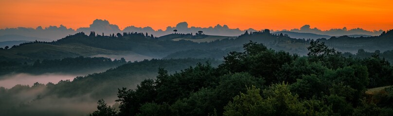 Beautiful Tuscany scenery with rolling hills at sunrise