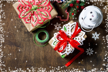 Merry Christmas concept. Packing presents for Christmas in handmade boxes, fir tree, present and...