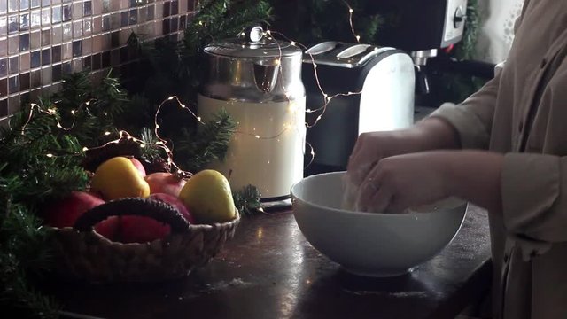 Woman cook kneads dough for cookies