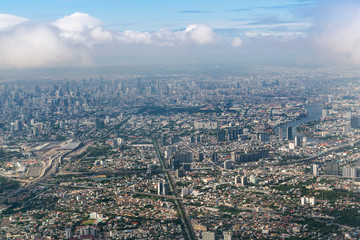 Fototapeta premium Aerial view of Bangkok city from airplane window.
