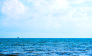 The sea in the dark blue sky on the day of bright