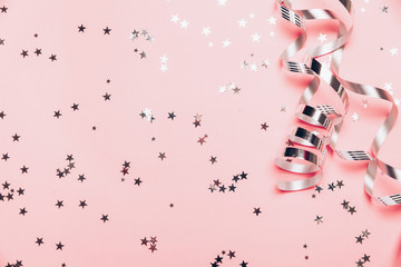 Cute happy little girl Laughing in Christmas atmosphere with gift boxes and magic lights.