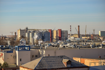 Roofs of industrial plant with high-rise smokable pipes