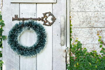 Christmas wreath on white wooden door , Christmas house decoration background