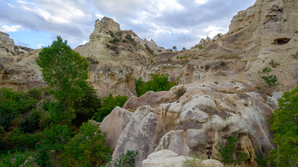 Mountain landscape in Pigeon valley in Cappadocia, Turkey. Unreal rock formations of Cappadocia
