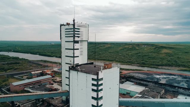 Coal mine with a shaft-head and multiple infrastructure buildings mine a lot of valuable coking coal for the industries of Russia. Copter ( drone ) shooting