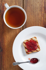 Tea and toasted bread with jam