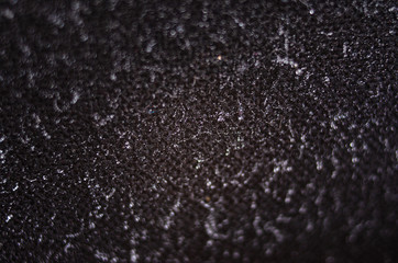 Drops of water on a black cloth. Water in macro on a black cloth. Wet cloth. The pile is wet. Background texture.