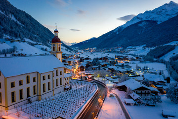 Winter morning cityscape in the Austrian town of Neustift. Aerial view of the town center and the...