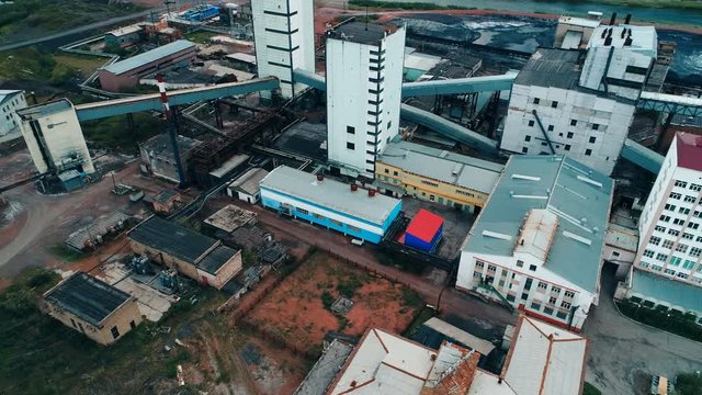 Coal mine with a shaft-head and multiple infrastructure buildings mine a lot of valuable coking coal for the industries of Russia. Copter ( drone ) shooting