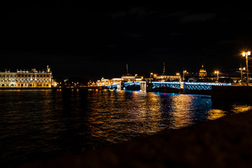 Fototapeta na wymiar bridge at night lights reflected in the river
