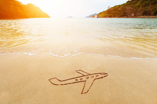 Travel vacation holiday concept. Drawing of jet plane on sand on the sea beach. Paradise tropical island background.