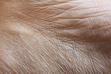 Closeup of wrinkles in Asian skin in deep layers. Skin repair and treatment concept for elderly and...