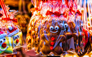 Sweet Gingerbread cookies food on Christmas market in Europe in winter. German Night street Xmas...