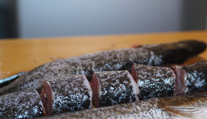 Shuka river fish on a cutting table in the village