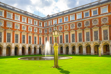 London, UK. English garden view and the East Front of Hampton court 17th century locates West London