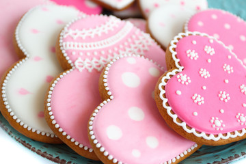 Set of pink heart shaped cookies with patterns, handmade