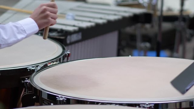 School student playing percussion in an orchestral band