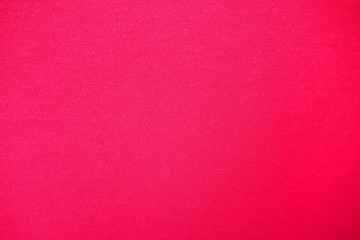 Closeup of beautiful and quality red and pink fabric with texture for textile, fashion beauty and simple background. Clothing and apparel concept.