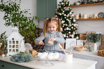 Smiling girl in Christmas kitchen at home.