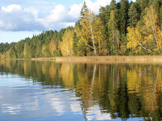 Obraz premium colorful autumn landscape with lake and gorgeous trees, beautiful reflections in calm water