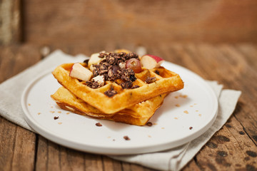 Homemade waffles with fruit and granola..