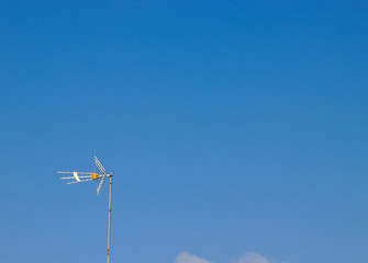 antenna on the left side with lots of copy space on blue sky