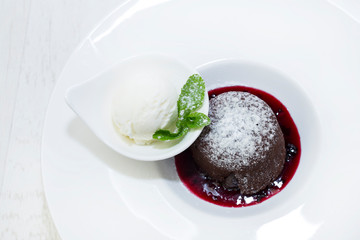 Dessert from a baking dish on tables in a restaurant is shot close-up