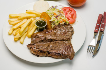 Grilled beef steak with rice and vegetables
