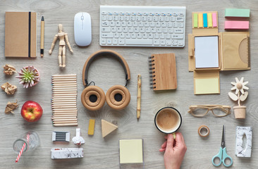 Concept flat lay with modern office supplies from eco friendly sustainable materials, craft paper, bamboo, and wood. Organize workspace routines avoiding single use plastic to reduce waste.