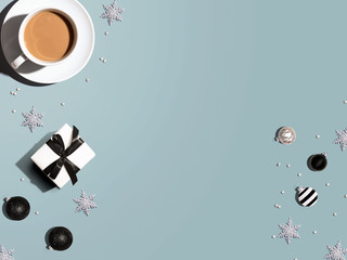 Christmas ornaments with a cup of coffee - flat lay