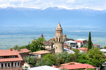 Fototapeta na wymiar Top view of Sighnaghi - small town in Georgia, city of love. Alazani Valley backdrop of Caucasus Mountains