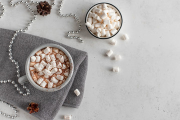 hot chocolate or coffee with marshmallows. winter drinks concept. white background, copy space, top view